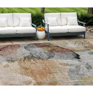 Photo of Terra Cotta Copper And Beige Floral Washable Indoor Outdoor Area Rug