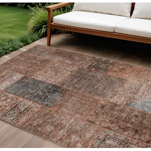 Photo of Terra Cotta Copper And Charcoal Patchwork Washable Indoor Outdoor Area Rug