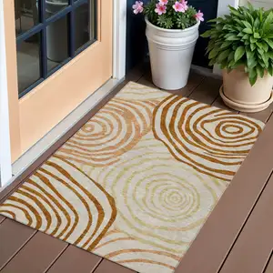 Photo of Terra Cotta Copper And Gold Abstract Washable Indoor Outdoor Area Rug