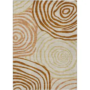 Photo of Terra Cotta Copper And Gold Abstract Washable Indoor Outdoor Area Rug