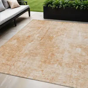 Photo of Terra Cotta Copper And Ivory Abstract Washable Indoor Outdoor Area Rug