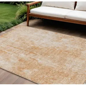 Photo of Terra Cotta Copper And Ivory Abstract Washable Indoor Outdoor Area Rug