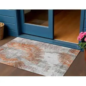 Photo of Terra Cotta Copper And Taupe Abstract Washable Indoor Outdoor Area Rug