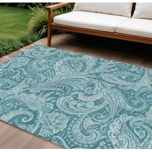 Photo of Turquoise And Ivory Paisley Washable Indoor Outdoor Area Rug