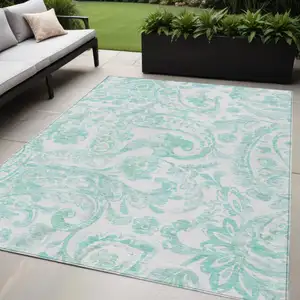 Photo of Turquoise And Ivory Paisley Washable Indoor Outdoor Area Rug