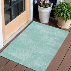 Photo of Turquoise And Teal Blue Abstract Washable Indoor Outdoor Area Rug