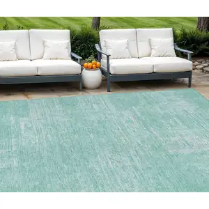 Photo of Turquoise And Teal Blue Abstract Washable Indoor Outdoor Area Rug