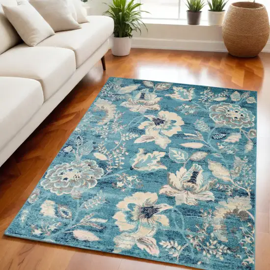 Turquoise Cream and Navy Blue Floral Distressed Area Rug Photo 1