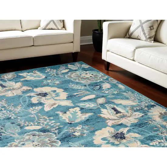 Turquoise Cream and Navy Blue Floral Distressed Area Rug Photo 1