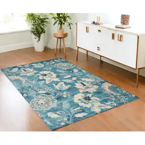 Photo of Turquoise Cream and Navy Blue Floral Distressed Area Rug