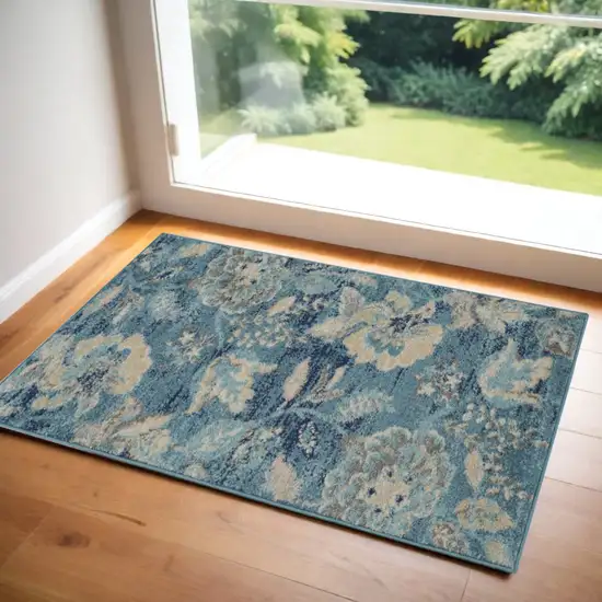 Turquoise Cream and Navy Blue Floral Distressed Area Rug Photo 1