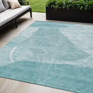 Photo of Turquoise Teal Blue And Ivory Abstract Washable Indoor Outdoor Area Rug