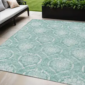 Photo of Turquoise Teal Blue And Ivory Medallion Washable Indoor Outdoor Area Rug