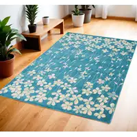 Photo of Turquoise and Cream Botanical Leaves Area Rug