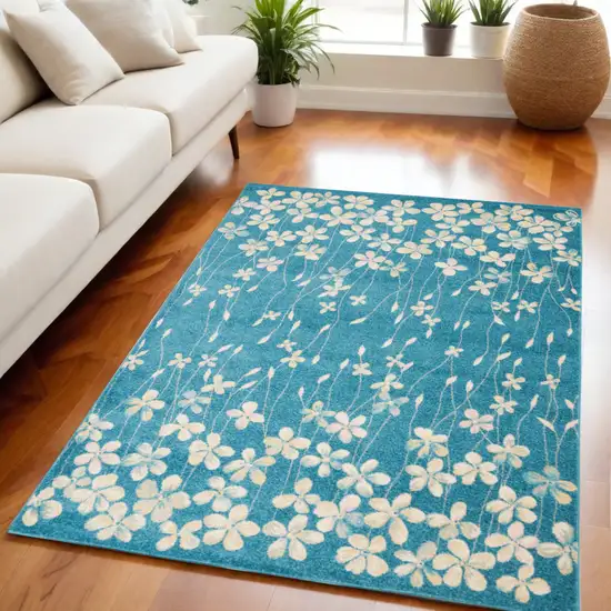 Turquoise and Cream Floral Area Rug Photo 1