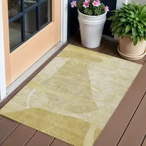 Photo of Wheat Gold And Ivory Abstract Washable Indoor Outdoor Area Rug