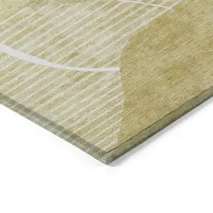 Photo of Wheat Gold And Ivory Abstract Washable Indoor Outdoor Area Rug