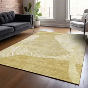 Photo of Wheat Gold And Ivory Abstract Washable Indoor Outdoor Area Rug