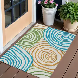 Photo of White Orange And Teal Blue Abstract Washable Indoor Outdoor Area Rug