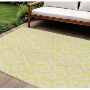 Photo of Yellow And Ivory Geometric Washable Indoor Outdoor Area Rug