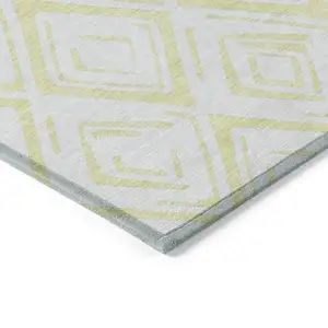 Photo of Yellow And Ivory Geometric Washable Indoor Outdoor Area Rug