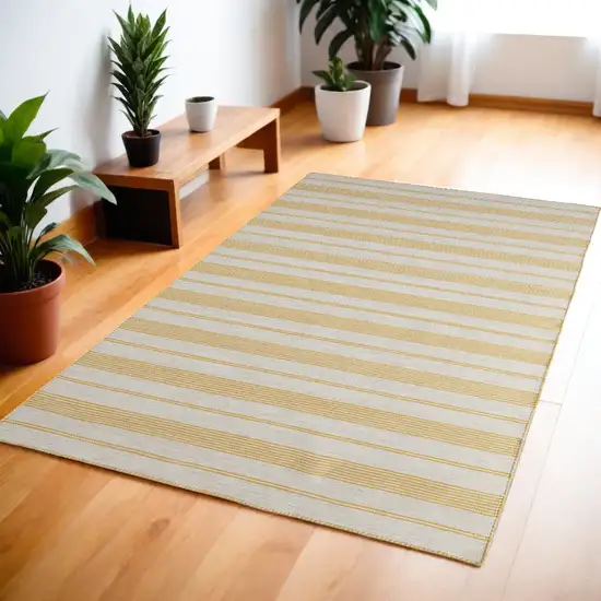 Yellow And Ivory Striped Dhurrie Hand Woven Stain Resistant Area Rug Photo 1