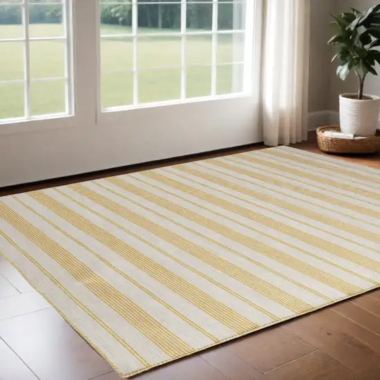 Yellow And Ivory Striped Dhurrie Hand Woven Stain Resistant Area Rug Photo 1