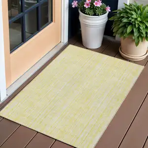 Photo of Yellow And Ivory Striped Washable Indoor Outdoor Area Rug