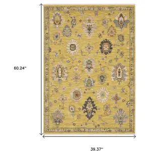 Photo of Yellow Ivory And Gray Oriental Area Rug With Fringe