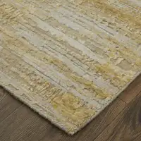 Photo of Yellow and Ivory Abstract Hand Woven Area Rug