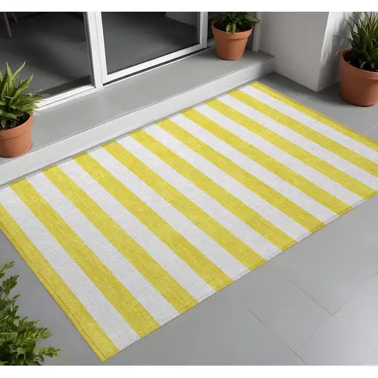 Yellow and White Striped Washable Indoor Outdoor Area Rug Photo 1